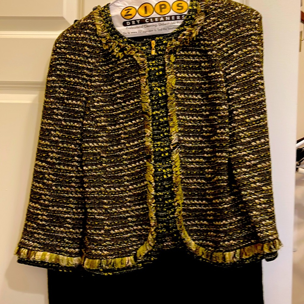 Two piece St. John knit skirt suit. Dry cleaned. Like new. Size 4